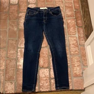 Abercrombie and Fitch dark washed mid rise jeans.